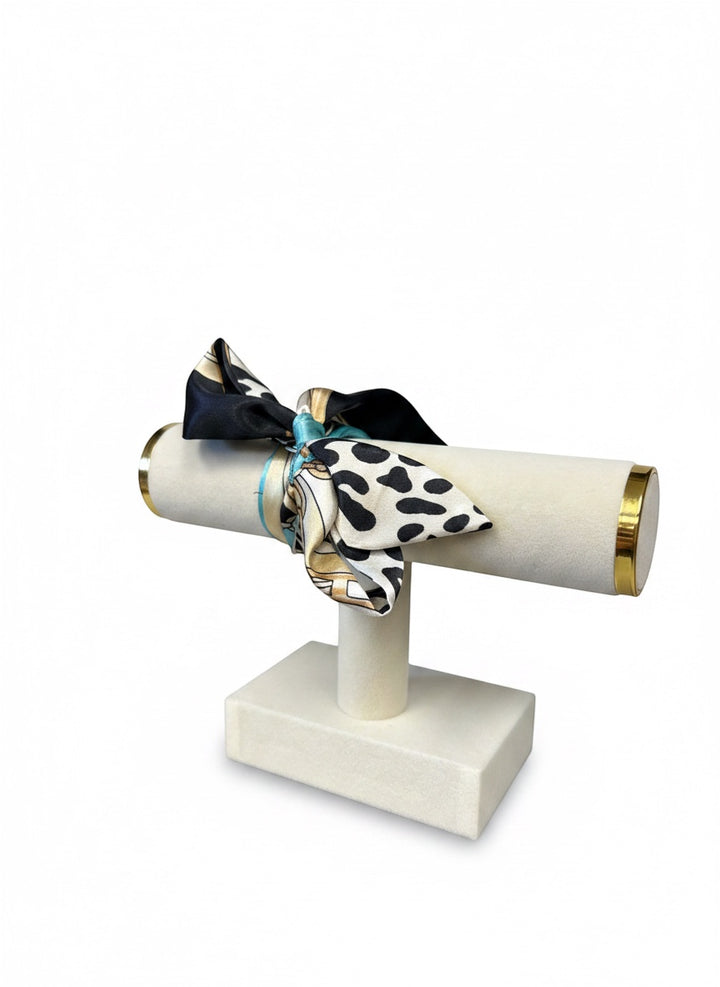 Chic Collective Uptown Wild Tie Scarf: black, white, and turquoise animal print silk scarf with gold chain accents.