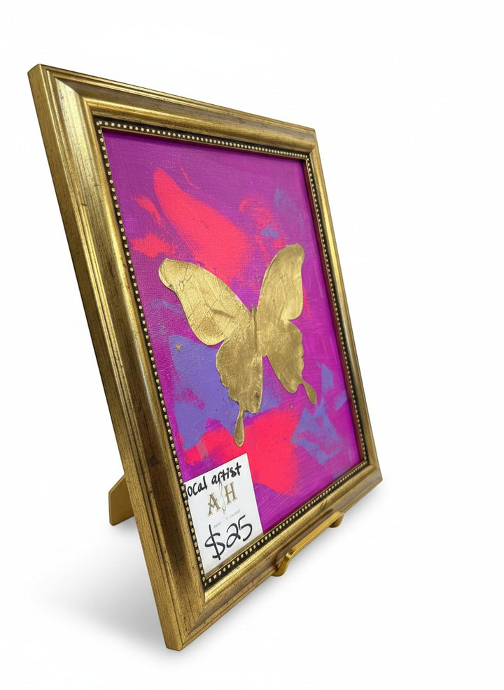 Chic Collective Violet Flight painting with gold butterfly on vibrant magenta, orchid, fuchsia, and violet background. Ornate gold frame.