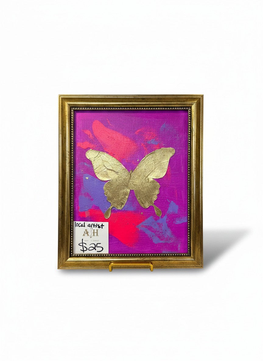 Chic Collective Violet Flight painting with gold butterfly on vibrant magenta, orchid, fuchsia, and violet background. Ornate gold frame.