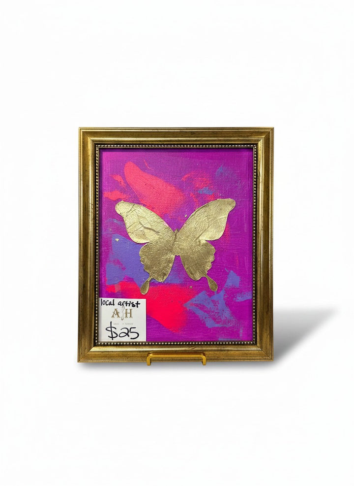 Chic Collective Violet Flight painting with gold butterfly on vibrant magenta, orchid, fuchsia, and violet background. Ornate gold frame.
