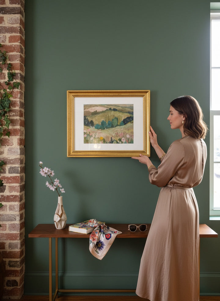 Chic Collective Whispering Hills framed landscape art with muted olive greens, sage, blush florals, and blue trees.