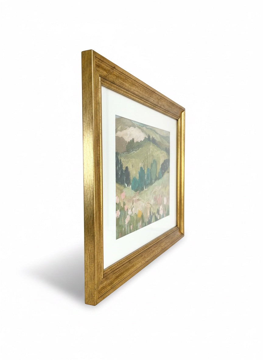 Chic Collective Whispering Hills framed landscape art with muted greens, sage, blush florals, and blue trees.