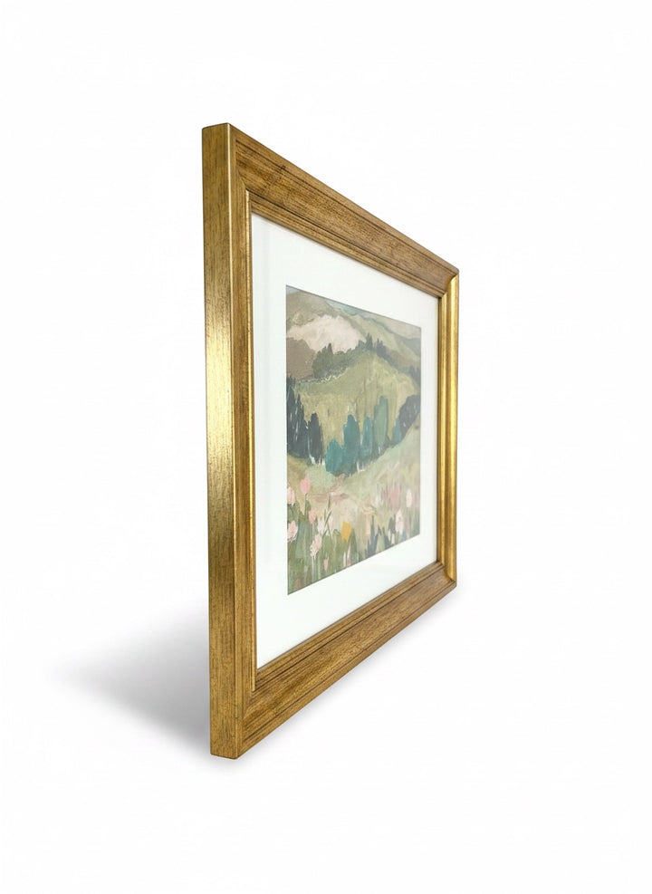 Chic Collective Whispering Hills framed landscape art with muted greens, sage, blush florals, and blue trees.