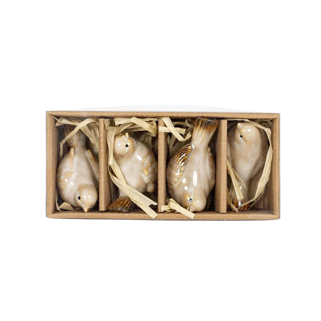 Chic Collective Nalin Set of 4 white ceramic bird accents with cream reactive glaze finish, in giftable packaging.