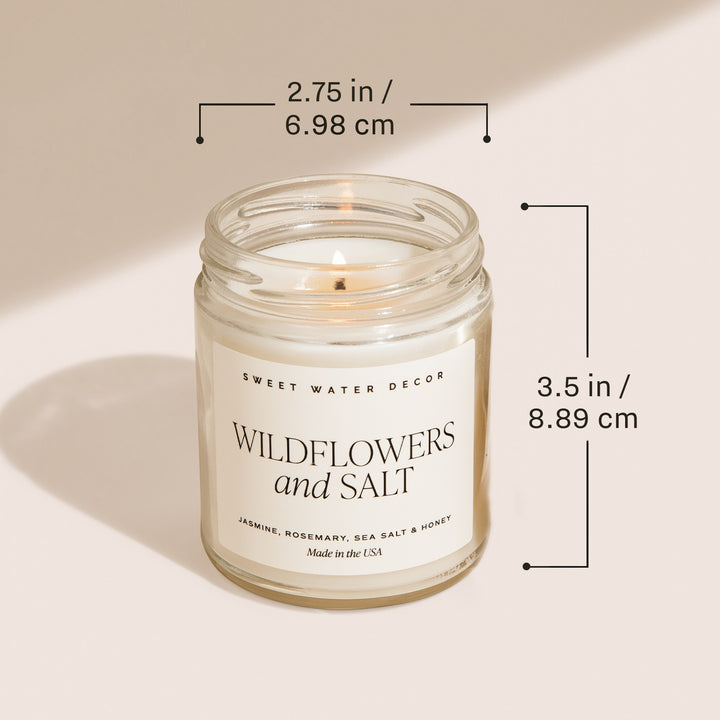 Chic Collective 9 oz soy candle in a clear glass jar with a cream label that reads "Wildflowers and Salt".