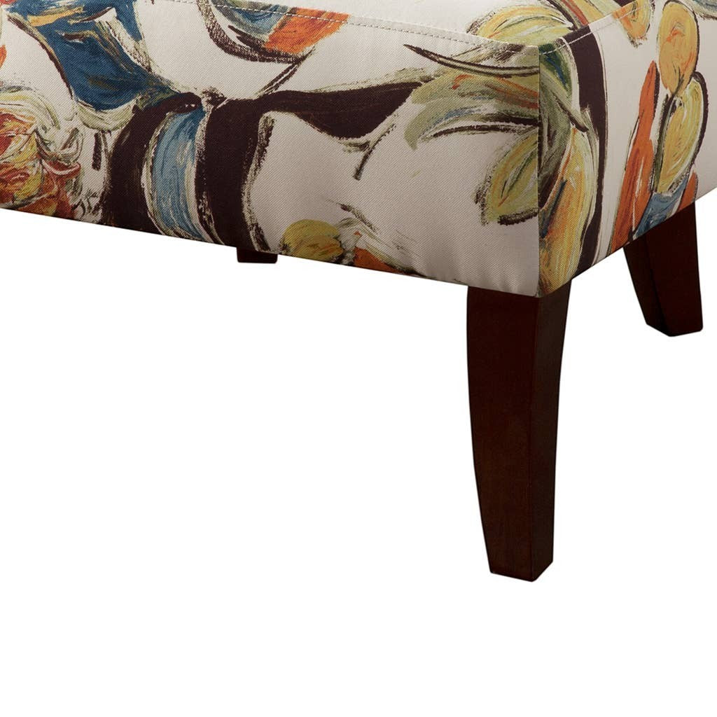 Chic Collective modern abstract armless slipper chair with cream upholstery featuring a colorful floral print and dark wood legs.