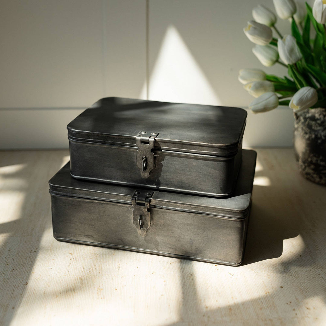 Chic Collective Pearl antique silver metal storage boxes set of two with latches and hinges, perfect for traditional or coastal decor.