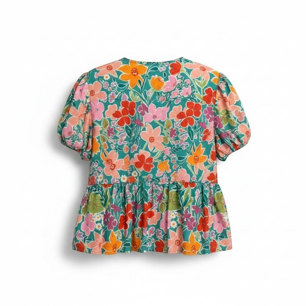 Chic Collective aqua green blouse with a vibrant floral print, puff sleeves, and tiered hem. Features pink, orange, and red flowers.