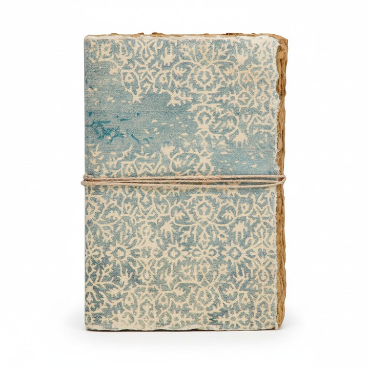 Chic Collective artisan journal with blue and cream decorative binding, deckled edges, and twine closure.