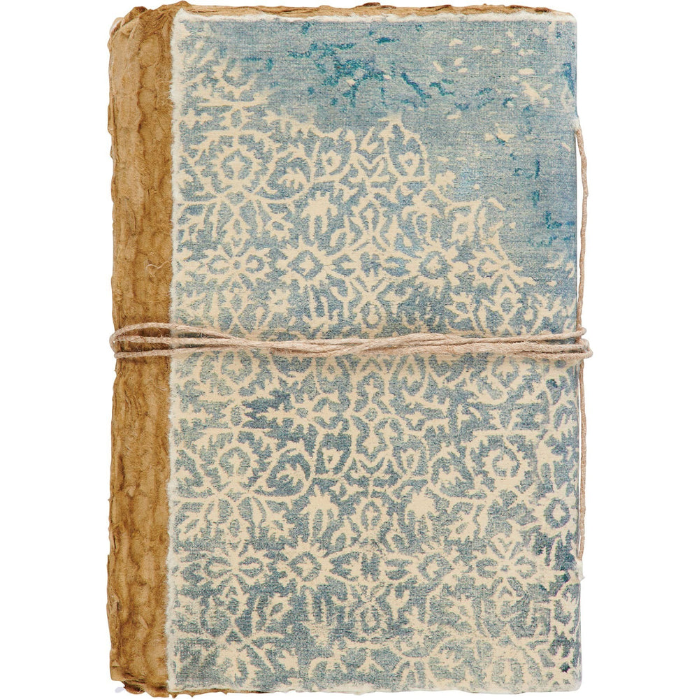 Chic Collective artisan journal with decorative binding, blue and cream pattern, deckled edges, and twine closure.