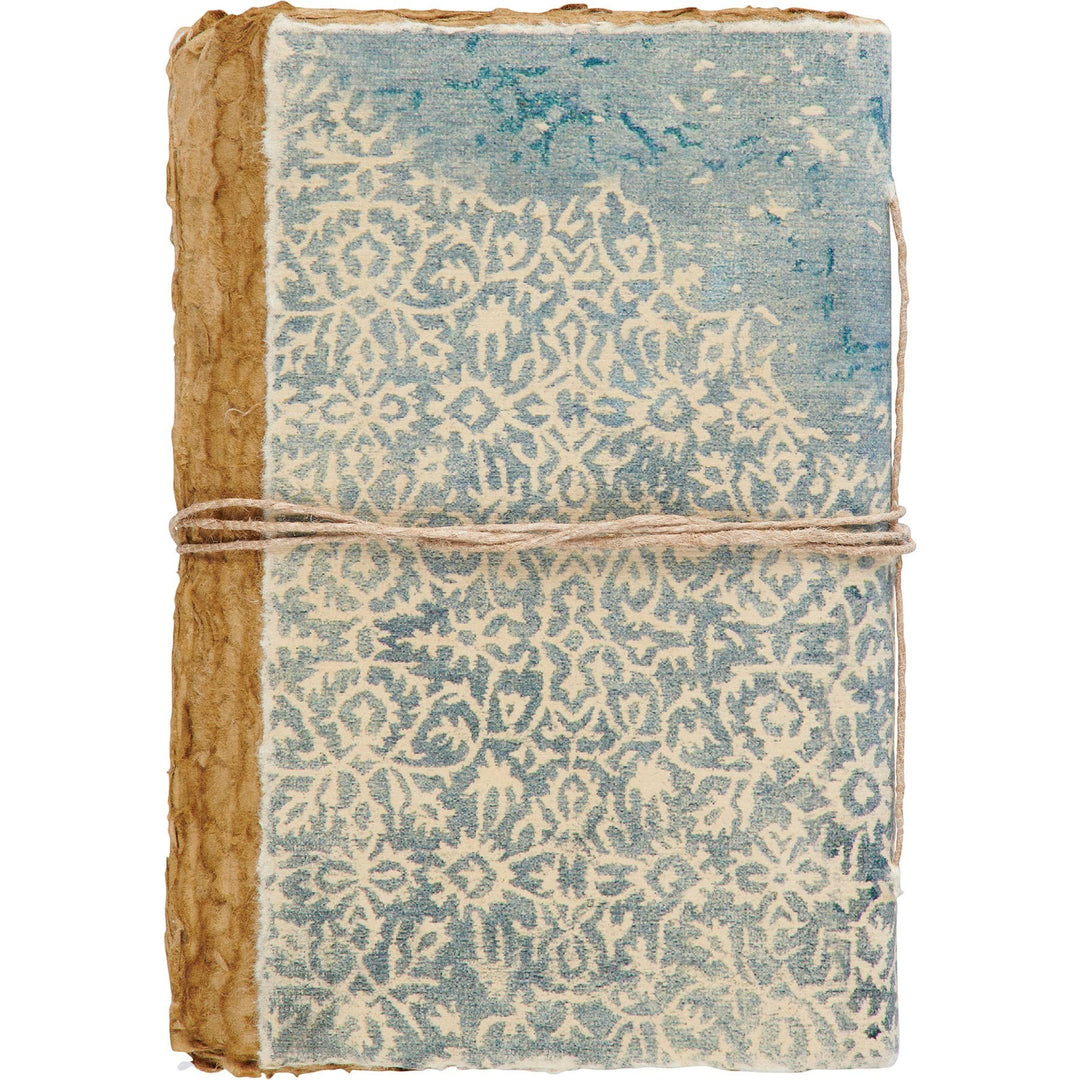 Chic Collective artisan journal with decorative binding, blue and cream pattern, deckled edges, and twine closure.