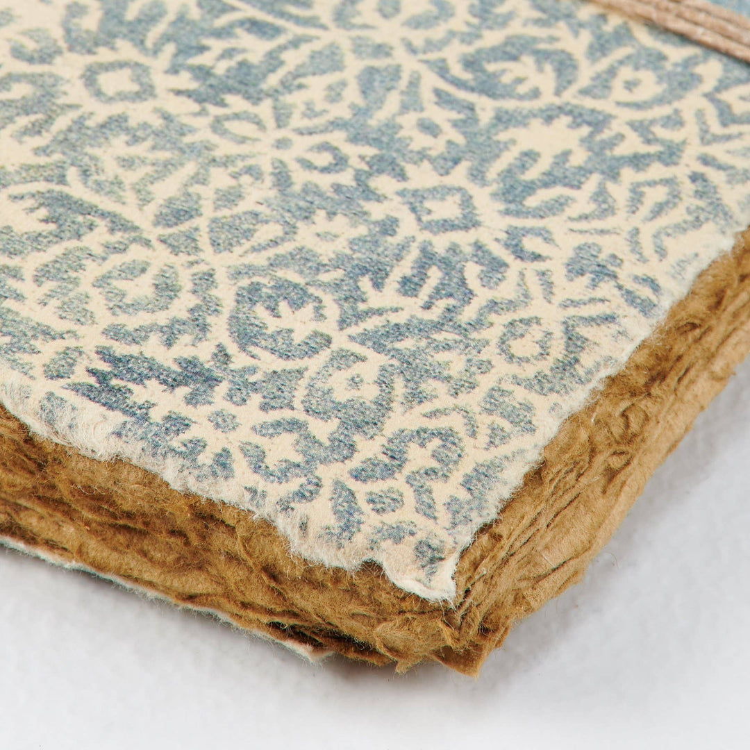Chic Collective artisan journal with blue and cream patterned cover and deckled edges.