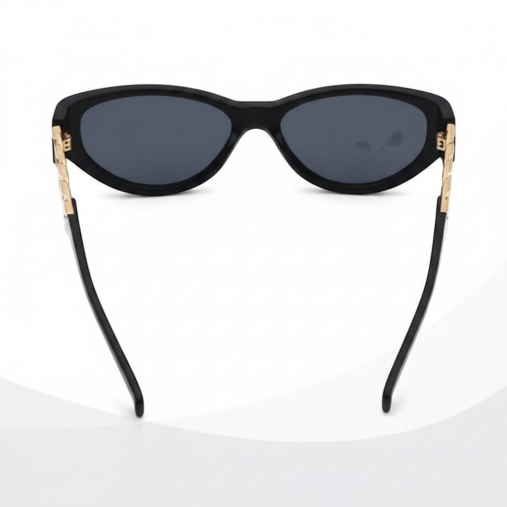 Chic Collective black cat-eye sunglasses with gold chain accents and dark polarized lenses.