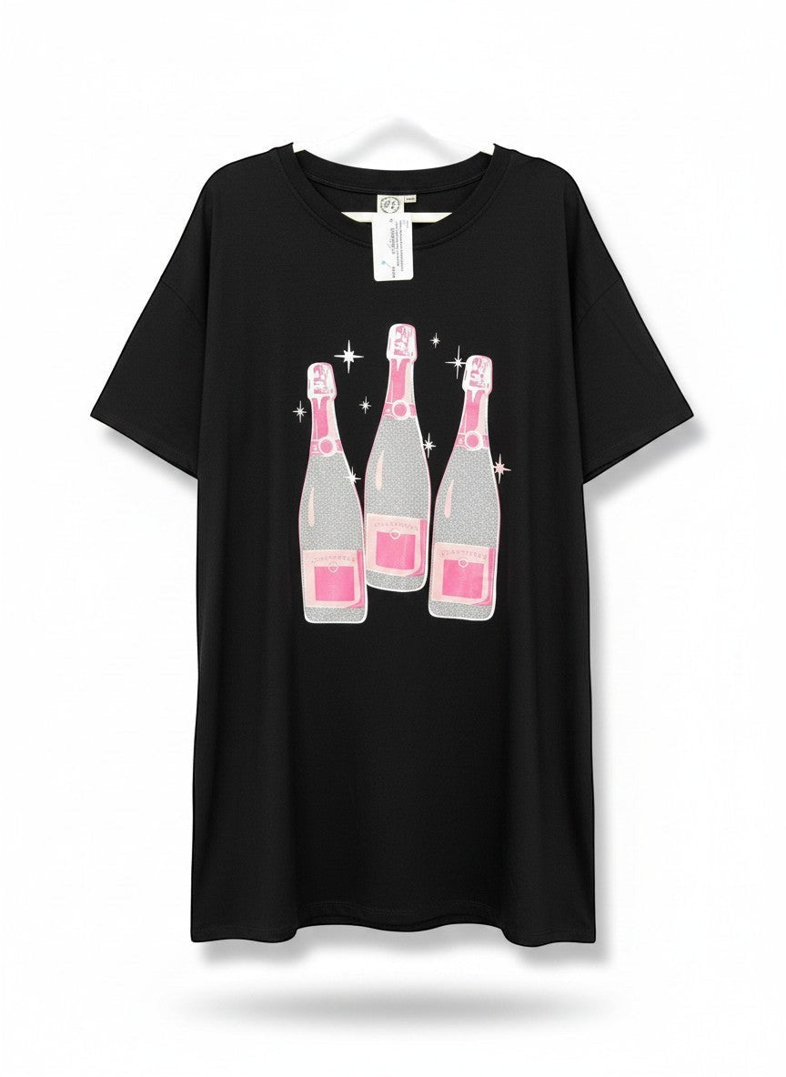 Chic Collective black oversized tunic with a graphic of three pink and silver champagne bottles with glitter accents.