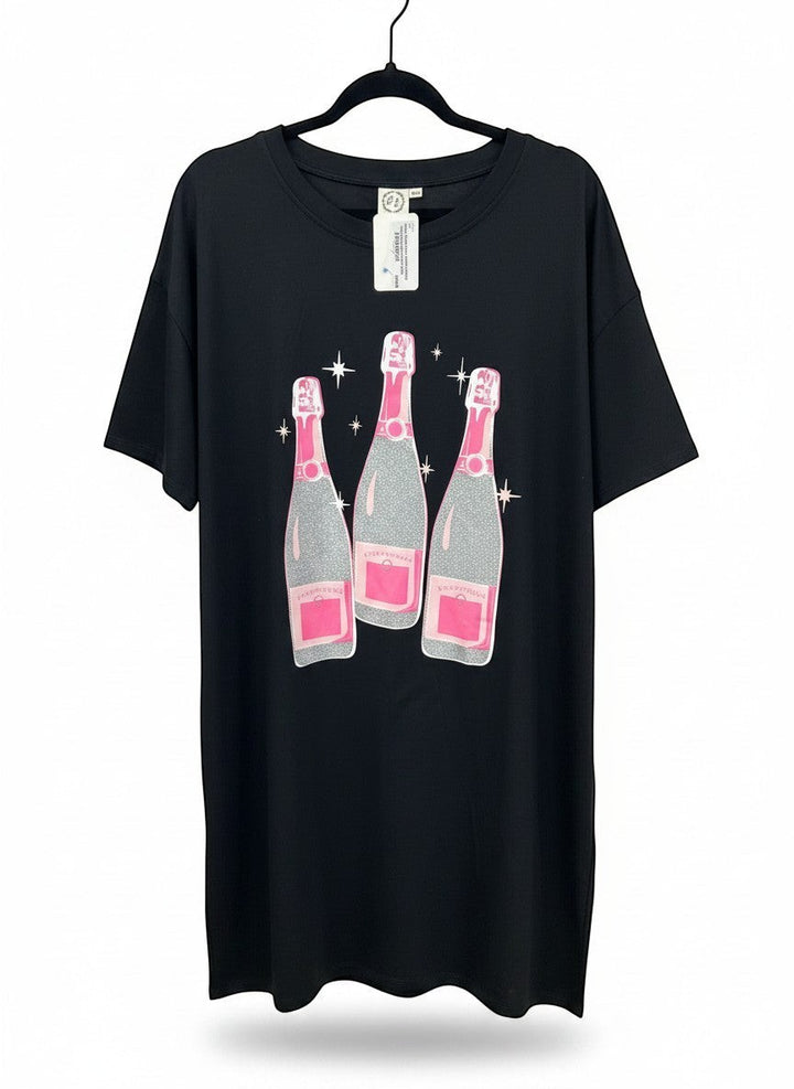 Chic Collective black oversized tunic with a graphic of three glittery champagne bottles with pink accents.