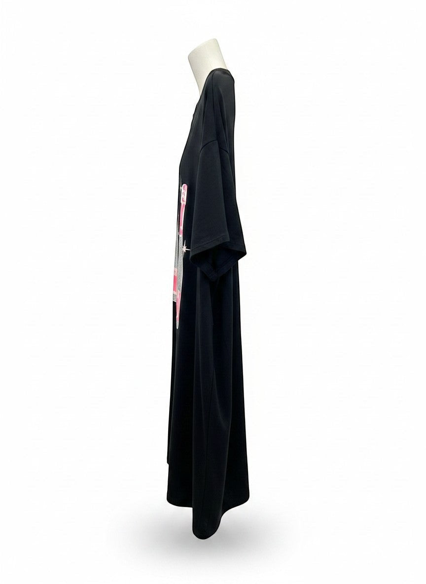 Chic Collective black oversized tunic with champagne bottle graphic and pink accents. Soft, breathable fabric.