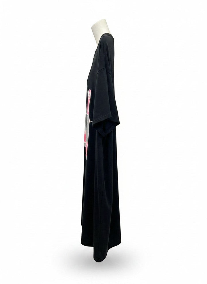Chic Collective black oversized tunic with champagne bottle graphic and pink accents. Soft, breathable fabric.
