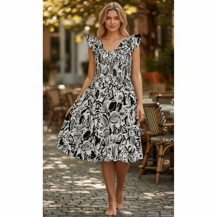 Chic Collective black and cream print smocked midi dress with ruffled cap sleeves and a square neckline.