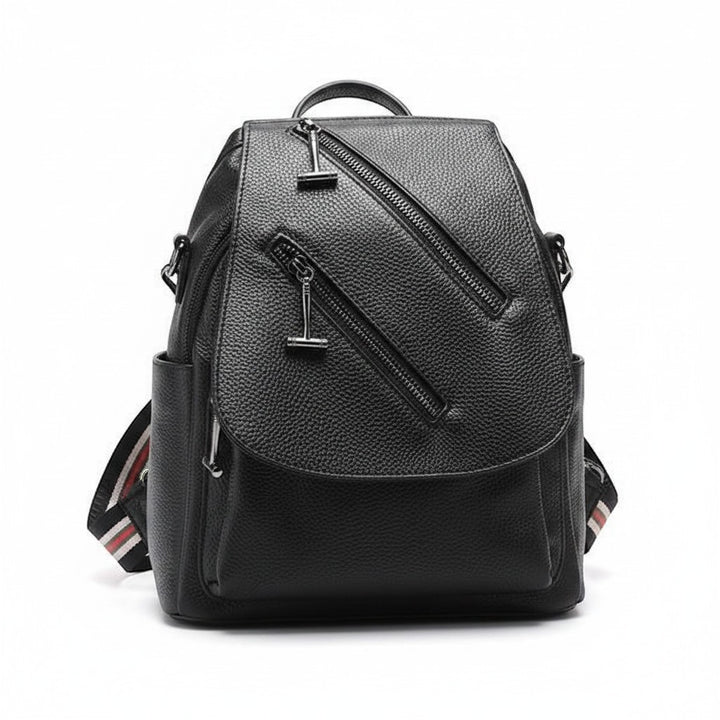 Chic Collective black textured leather backpack with diagonal zipper details and striped shoulder straps.
