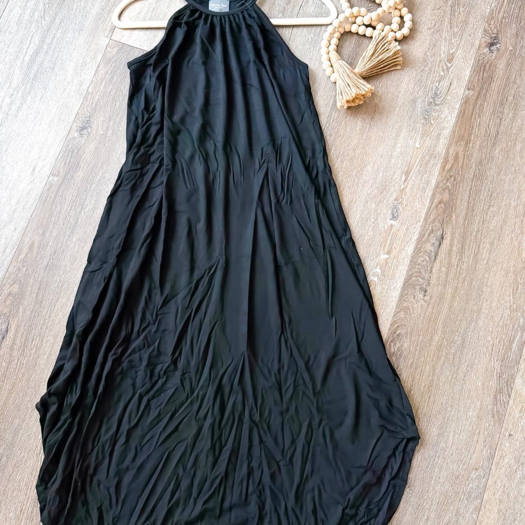 Chic Collective black maxi dress with halter neck and flowing skirt, perfect for versatile styling.
