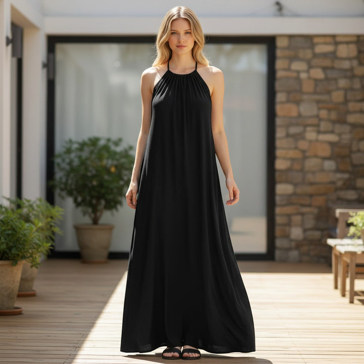 Chic Collective black maxi dress with halter neck and flowing skirt, perfect for versatile styling.