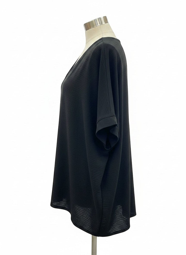 Chic Collective black textured V-neck dolman top with relaxed sleeves and a subtle textured fabric.