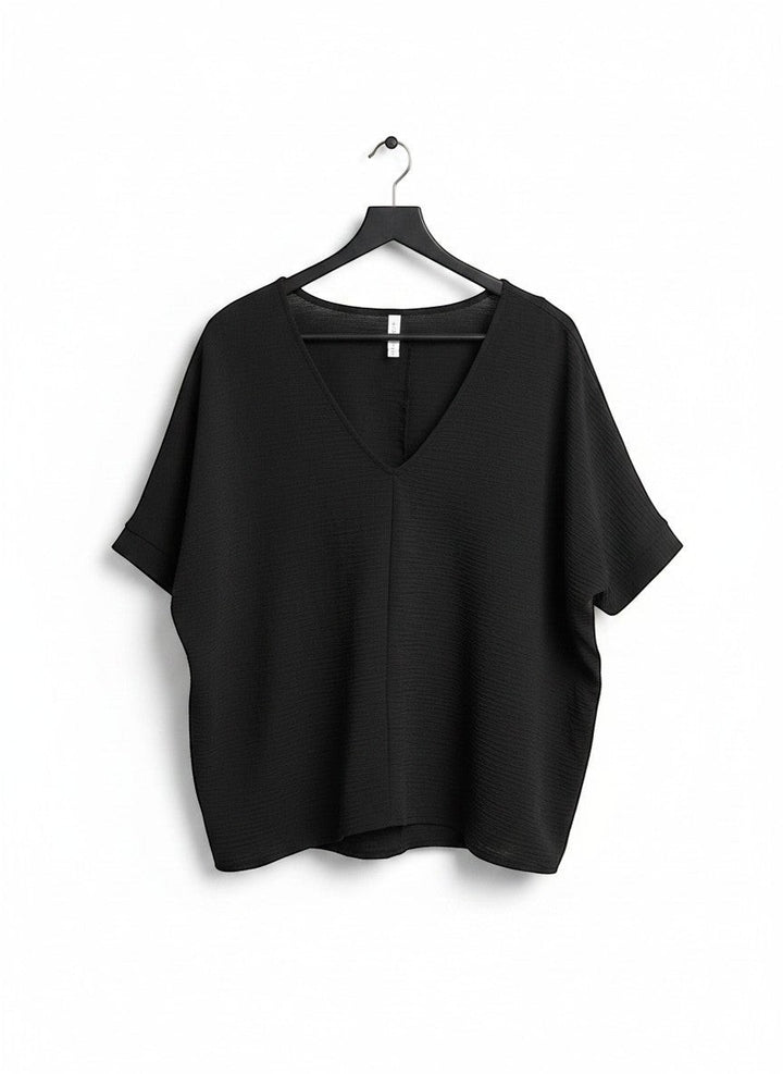 Chic Collective black textured V-neck dolman top with relaxed sleeves and a subtle textured fabric.