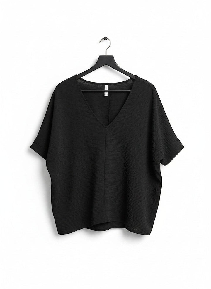 Chic Collective black textured V-neck dolman top with relaxed sleeves and a subtle textured fabric.