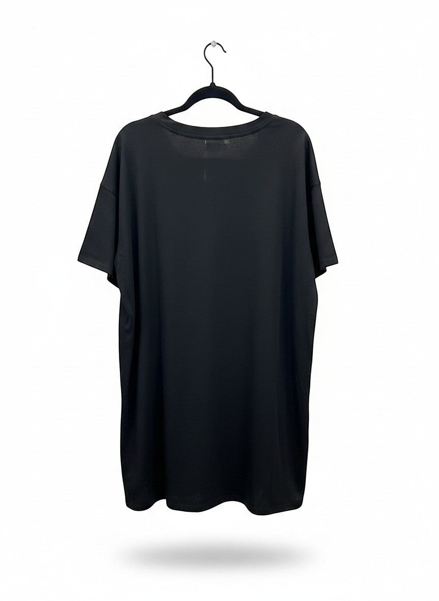 Chic Collective black oversized tunic with champagne bottle graphic and pink accents. Soft, breathable fabric.