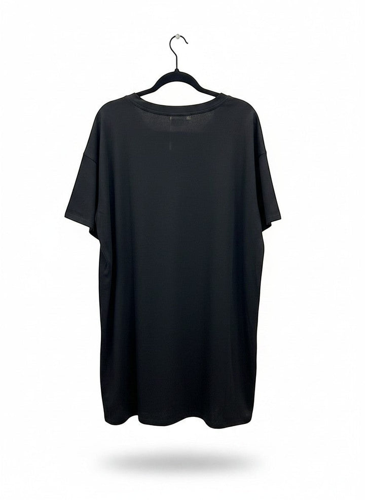 Chic Collective black oversized tunic with champagne bottle graphic and pink accents. Soft, breathable fabric.