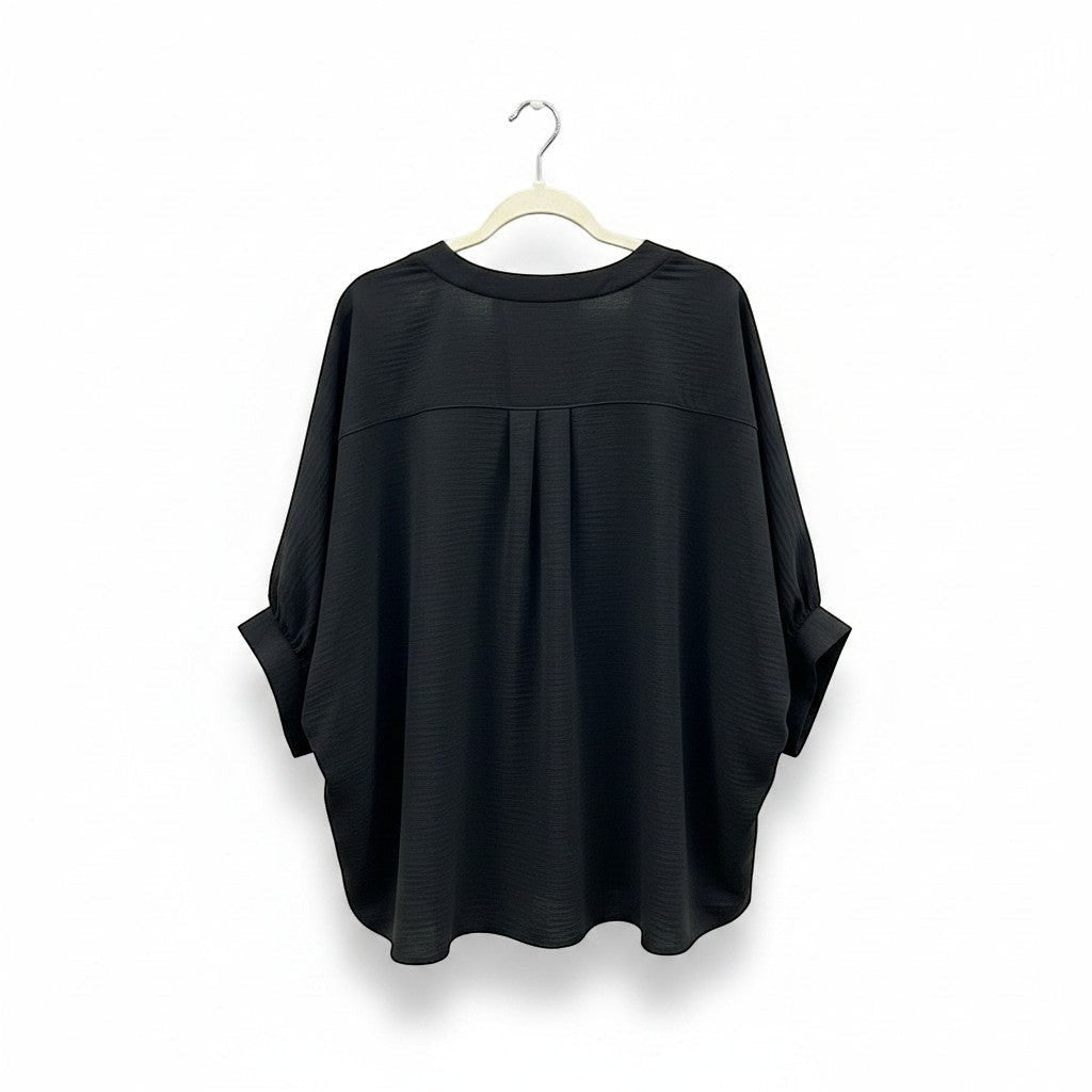 Chic Collective black woven airflow v-neck puff half-sleeve top with subtle texture and a relaxed fit.