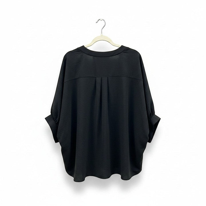 Chic Collective black woven airflow v-neck puff half-sleeve top with subtle texture and a relaxed fit.