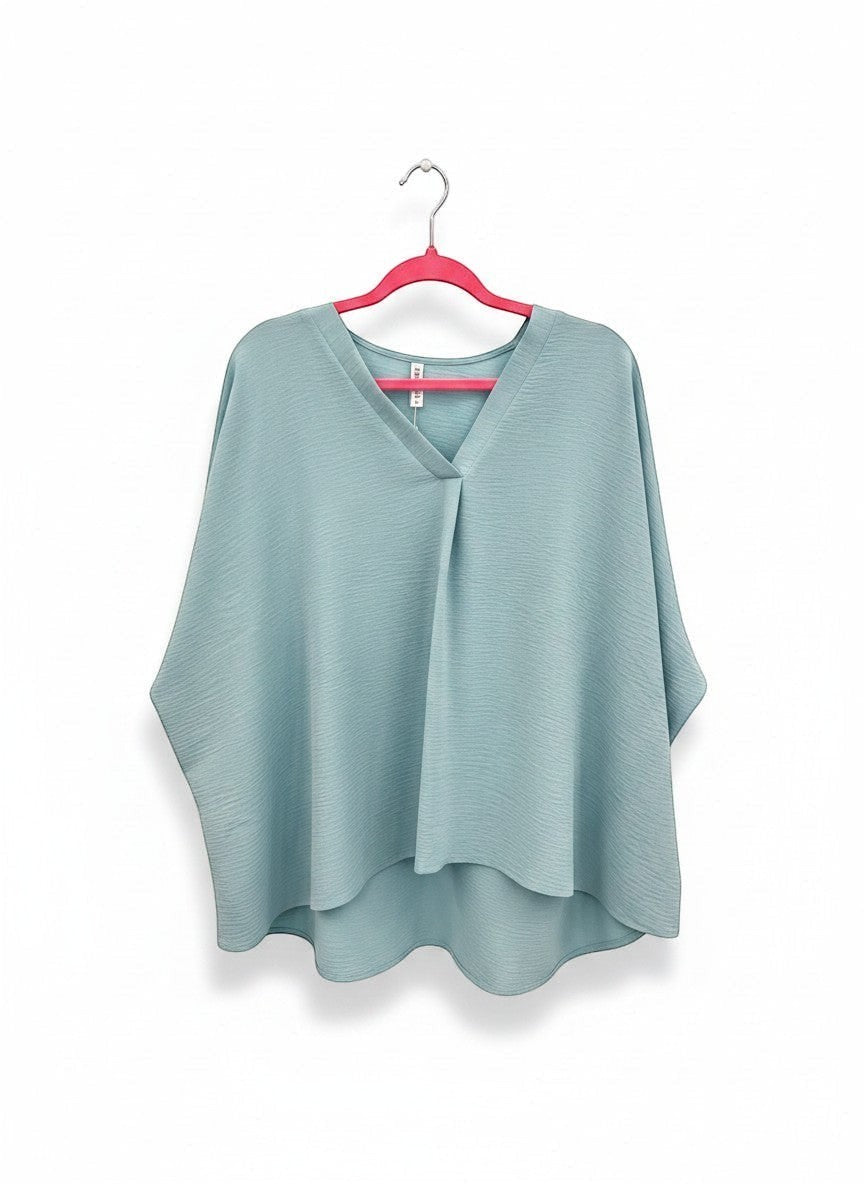 Chic Collective light blue textured V-neck dolman top with relaxed sleeves and a high-low hem.