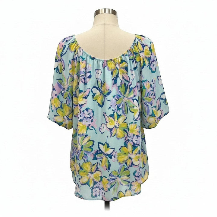 Chic Collective light blue floral print bubble sleeve top with yellow, green, and purple flowers.