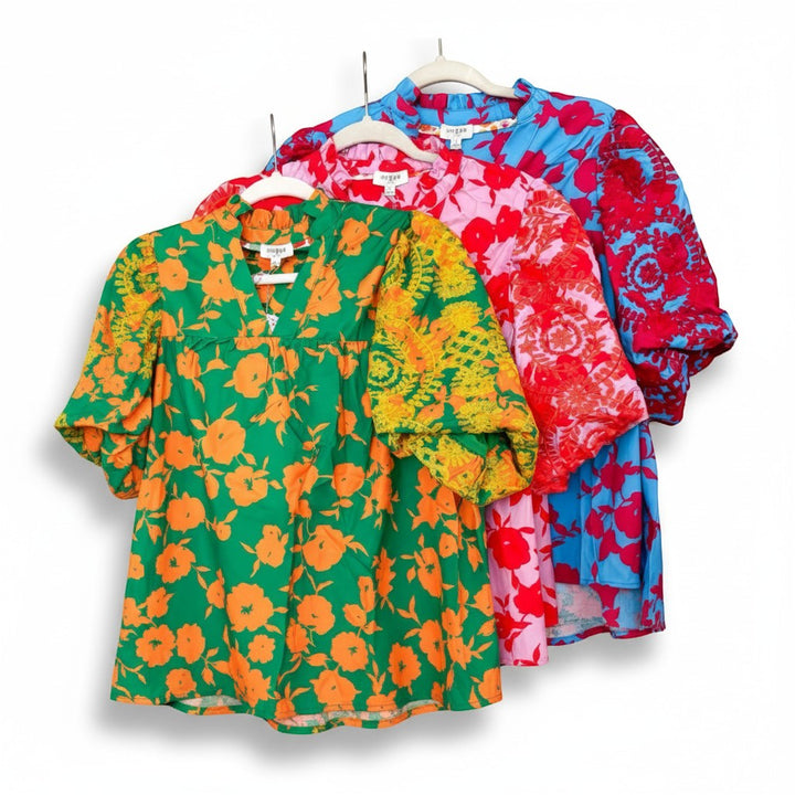 Chic Collective blue and fuchsia floral print tops with embroidery on sleeves. V-neck, short puff sleeves.