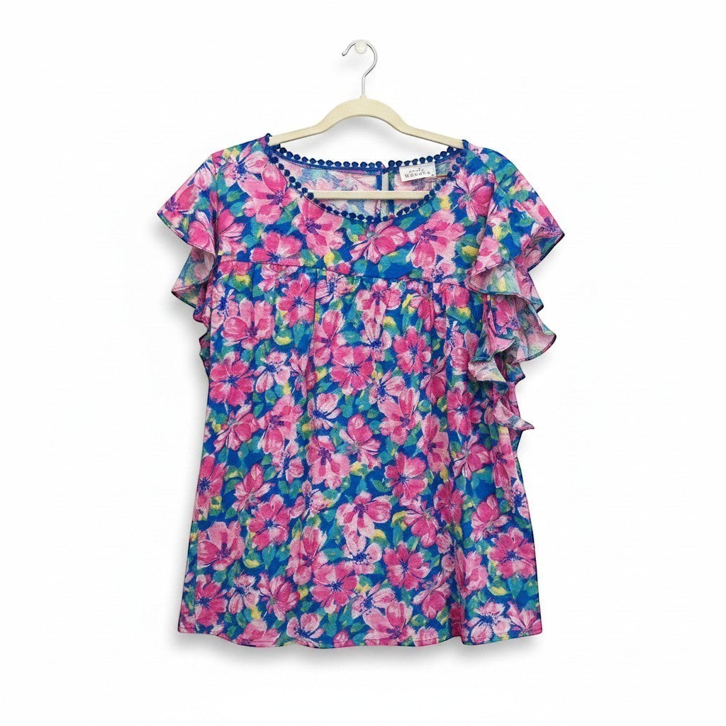 Chic Collective blue and pink hibiscus floral print ruffle top with pom-pom trim.