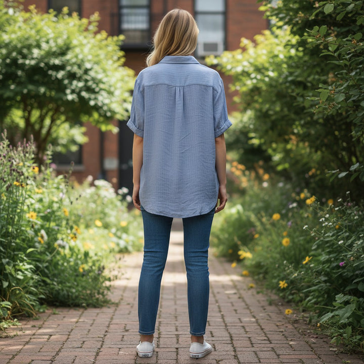 Chic Collective blue and white pinstripe relaxed fit short sleeve button-up top.