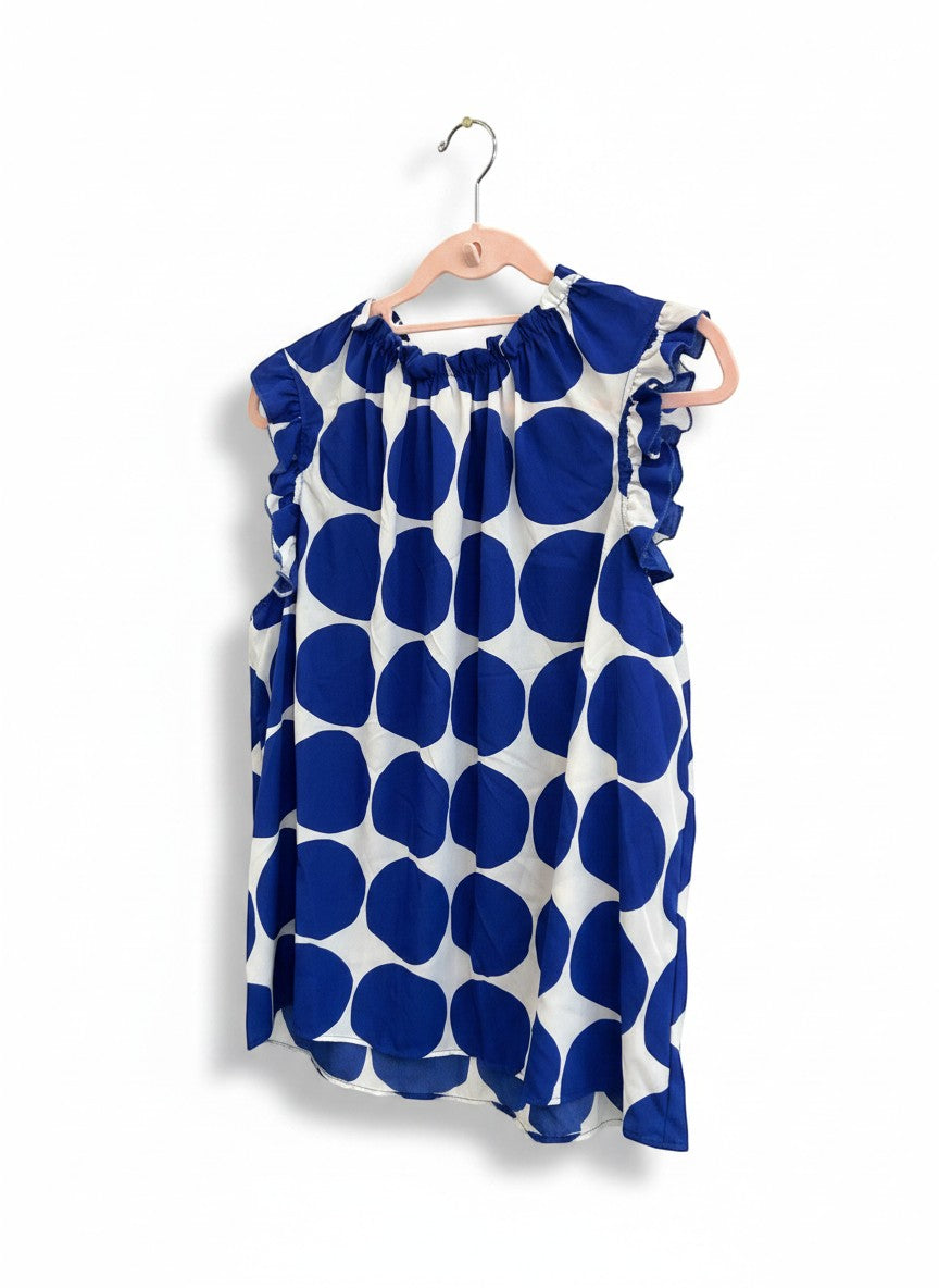 Chic Collective blue and white polka dot sleeveless blouse with ruffle neckline and sleeves.