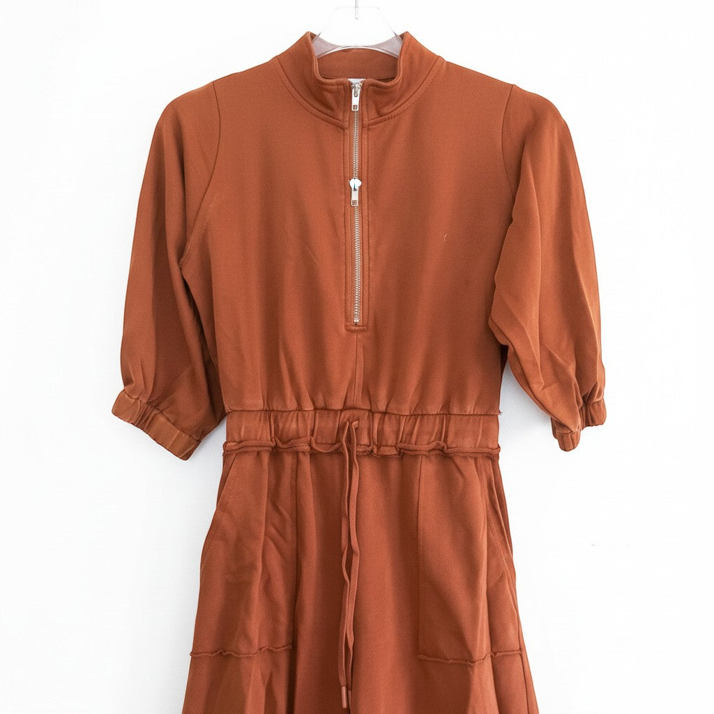 Chic Collective brown cotton blend jumpsuit with quarter zip neckline, elasticated waist with drawstring, and cuffed sleeves.