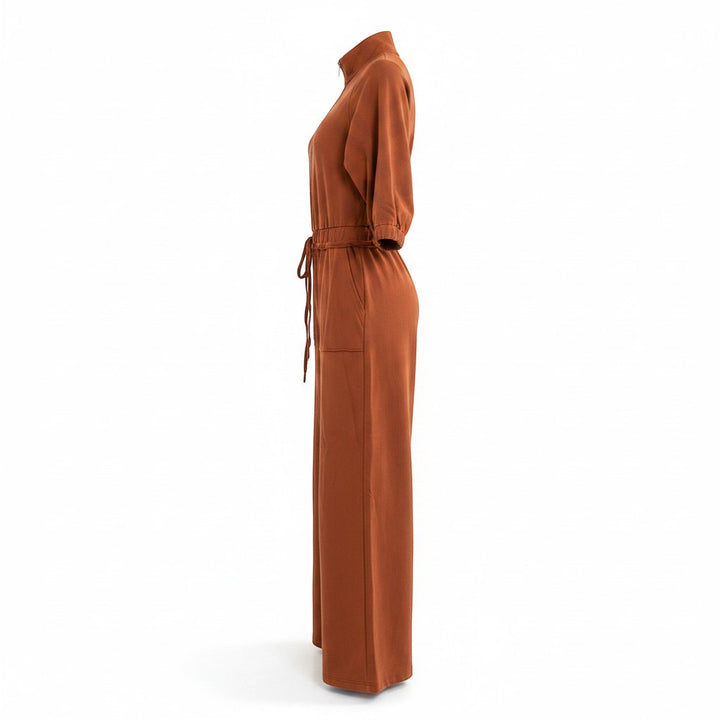 Chic Collective brown wide-leg jumpsuit with drawstring waist and zip neck.