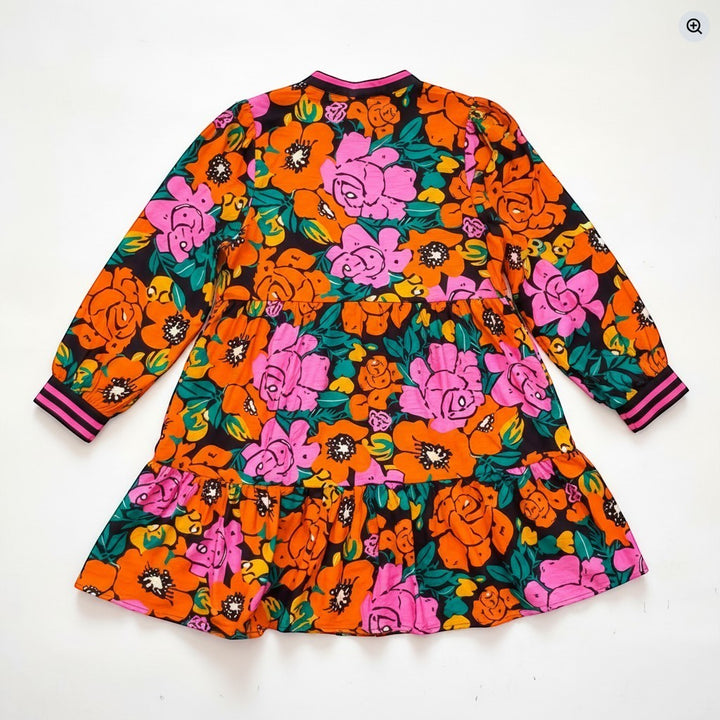Chic Collective colorful floral print tiered mini dress with long sleeves and pink striped cuffs.