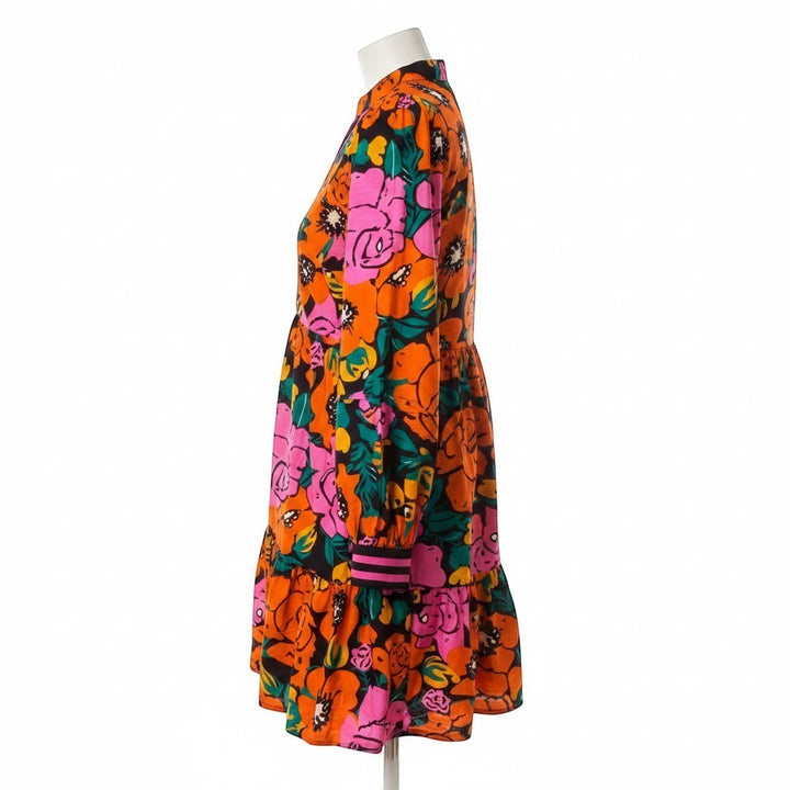 Chic Collective JODIFL colorful floral print dress with long sleeves, tiered skirt, and pink striped cuffs.