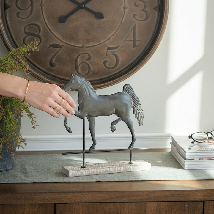 Chic Collective dark grey metal horse figurine on distressed wood stand with metal accents, perfect for farmhouse decor.