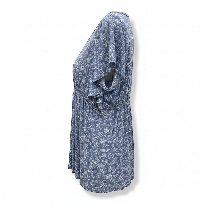 Chic Collective denim blue v-neck woven top with white floral print and flutter sleeves.