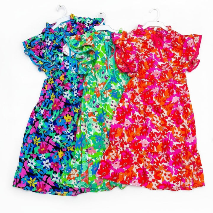 Chic Collective vibrant floral print dresses in green, blue, and pink with ruffled sleeves and tiered skirts.