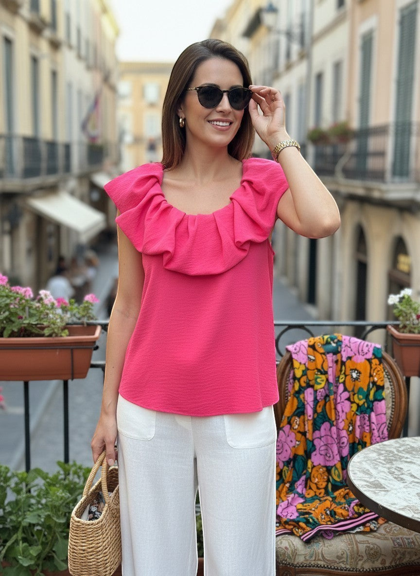 Chic Collective fuchsia solid color scrunch sleeve tank top with ruffled neckline, worn by a woman outdoors.