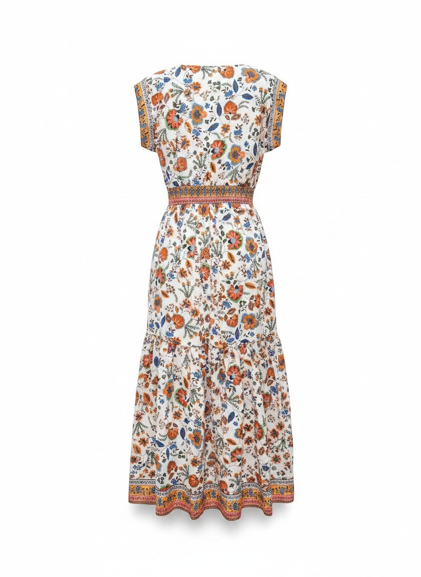 Chic Collective Gibson Paisley Maxi Dress with short sleeves, elasticated waist, and tiered skirt in a white floral print.