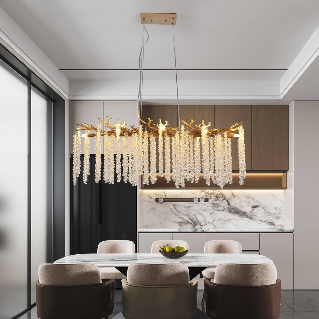 Chic Collective modern gold chandelier with cascading crystal strands and branch-like accents, 39.4 inches, ideal for dining rooms.
