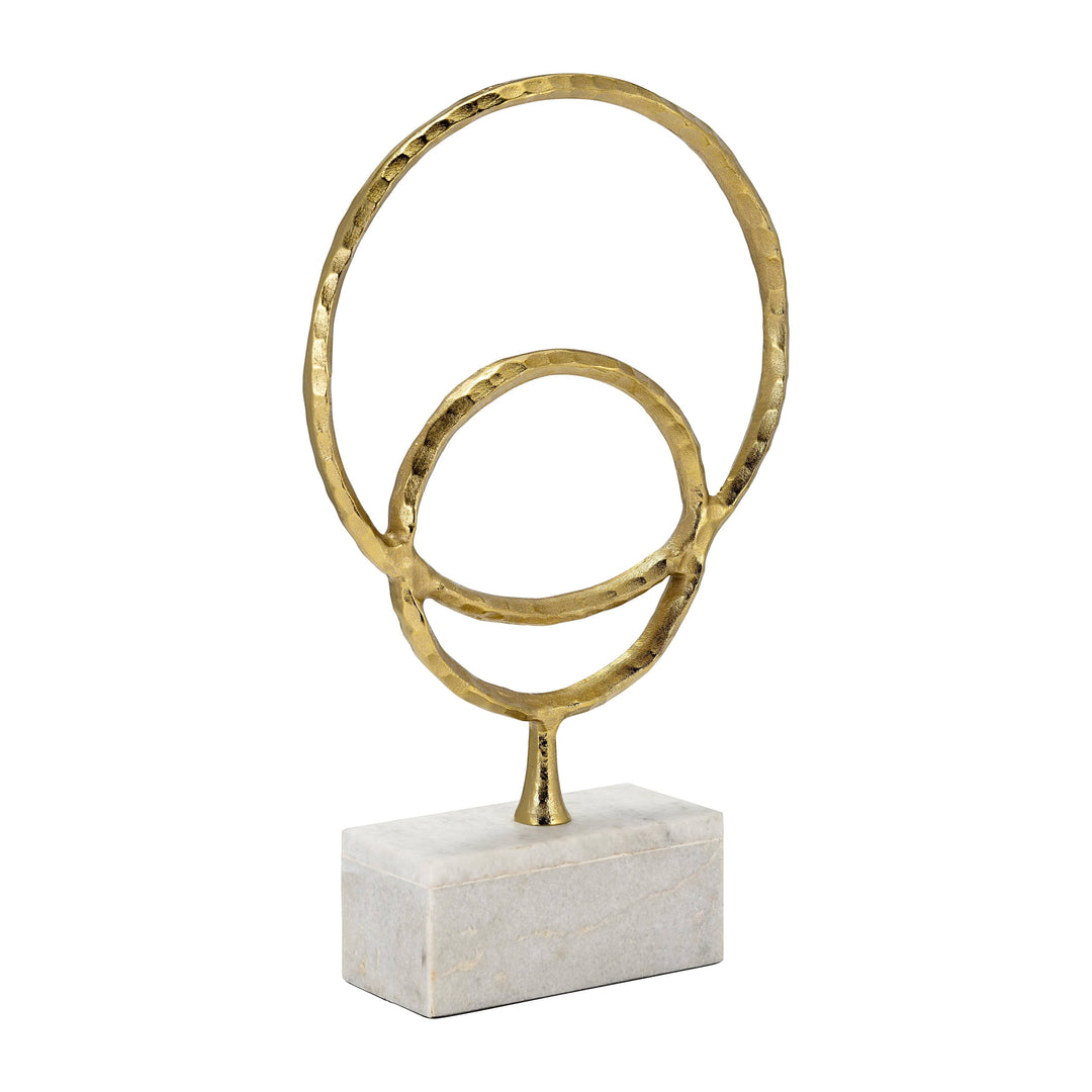 Chic Collective gold metal abstract double ring sculpture on a white marble base. Textured finish.