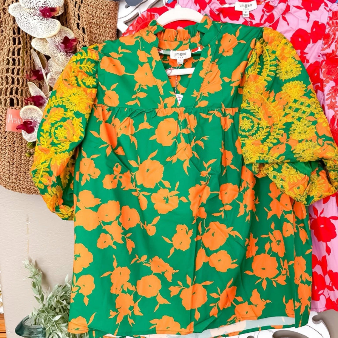 Chic Collective green and yellow floral print top with embroidered sleeves and V-neck. Casual or festive style.